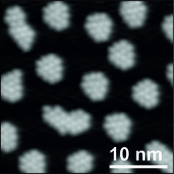 Low-temperature scanning tunneling microscopy (LT-STM) image of N-Heterocyclic Carbenes forming well-defined islands on Cu(111).