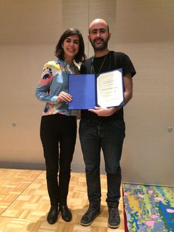 Yair Litman (right) with his supervisor Mariana Rossi (left) celebrating the award Litman received for the poster "Elucidating the Nuclear Quantum Dynamics of Porphycene" at the 81st Okazaki Conference in Okazaki, Japan, December 2019.